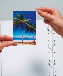 photo corners being placed on photograph
