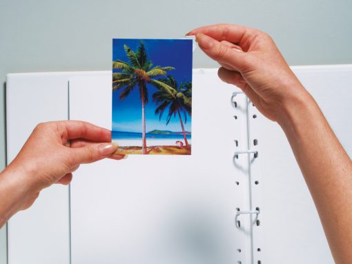 photo corners being placed on photograph